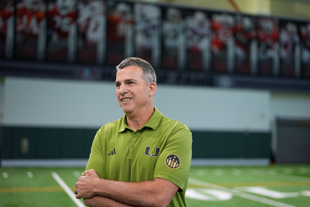 Miami football head coach Mario Cristobal stands on the team's indoor practice field in Coral Gables, Fla., Monday, Jan. 12, 2026. (AP Photo/Rebecca Blackwell)