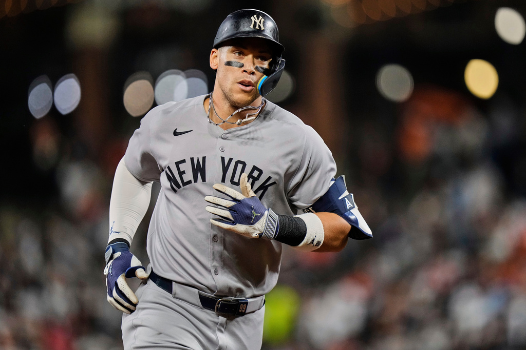 FILE - New York Yankees' Aaron Judge rounds the bases after hitting a home run during the third inning of a baseball game against the Baltimore Orioles, Sept. 20, 2025, in Baltimore. (AP Photo/Stephanie Scarbrough, File)