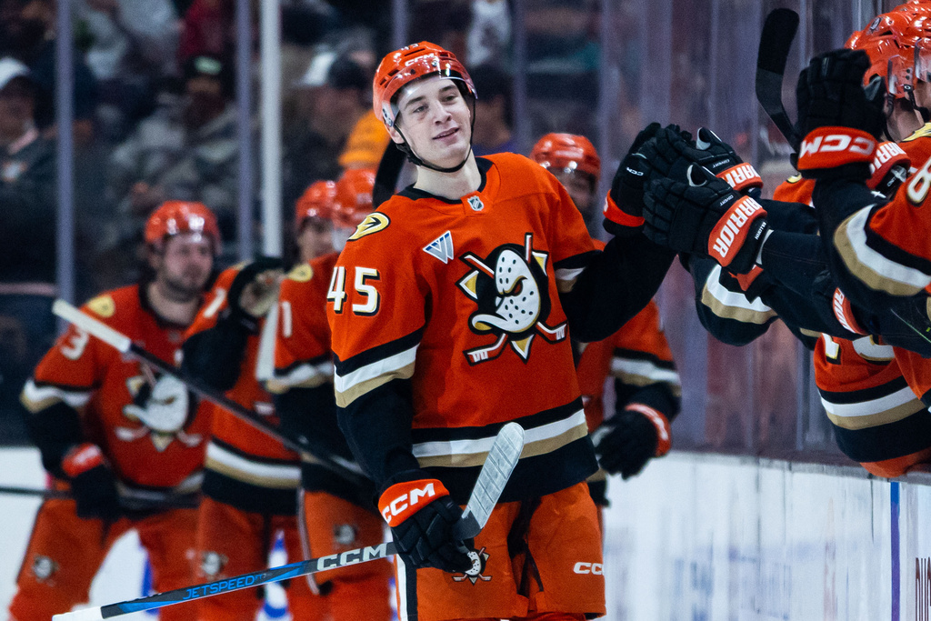 Anaheim Ducks right wing Beckett Sennecke (45) reacts after scoring against the Chicago Blackhawks during the second period of an NHL hockey game Sunday, Dec. 7, 2025, in Anaheim, Calif. (AP Photo/Ethan Swope)