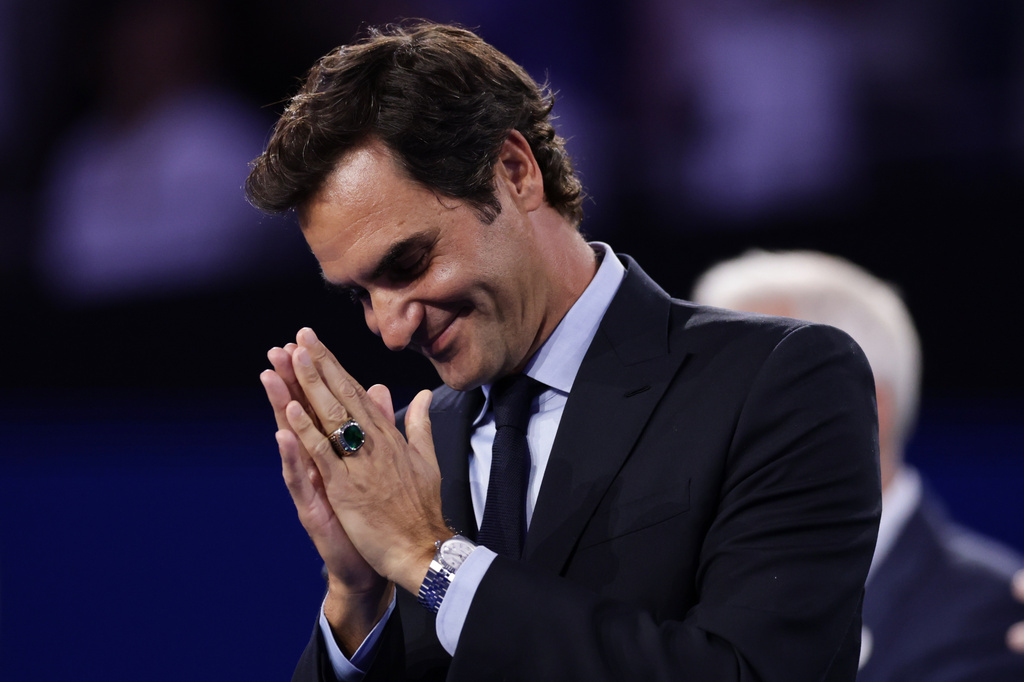 Roger Federer, former tennis player, gestures as he receives his Hall of Fame ring at the U.S. Open tennis championships Monday, Aug. 31, 2026, in New York. (AP Photo/Adam Hunger)