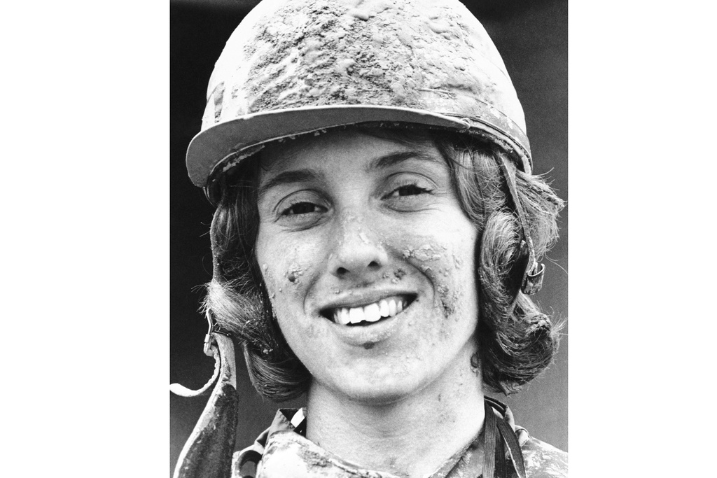 FILE - Jockey Diane Crump sports a mud pack on her cap and face after winning a Kentucky Derby race riding Right Sean, in Louisville, Kentucky, May 2, 1970. Crump, who in 1969 became the first woman to ride professionally in a horse race and a year later became the first female jockey in the Kentucky Derby, died Thursday, Jan. 1, 2026. She was 77. (AP Photo, File)
