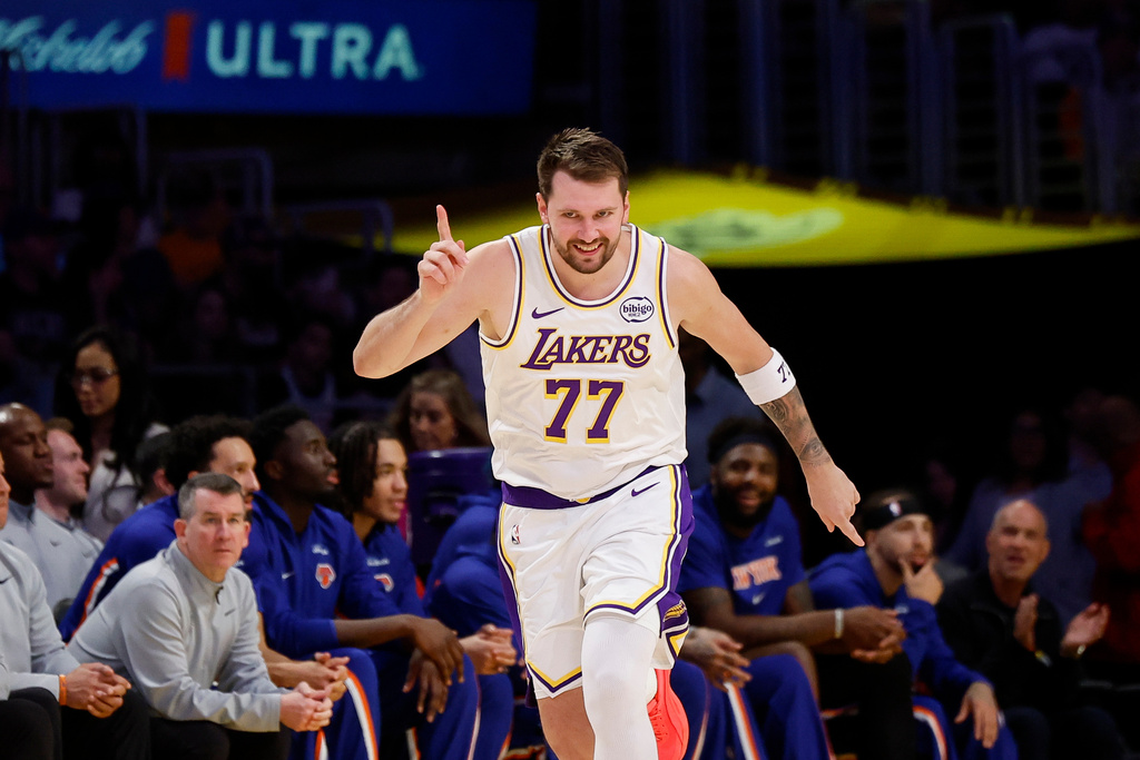 Los Angeles Lakers guard Luka Doncic reacts after scoring during the second half of an NBA basketball game against the New York Knicks, Sunday, March 8, 2026, in Los Angeles. (AP Photo/Caroline Brehman)