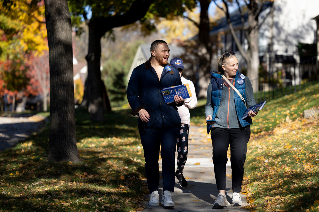 Minneapolis mayoral candidate Jazz Hampton, left, canvasses with Ward 11 city council member Emily Koski on Monday, Nov. 3, 2025, in southeast Minneapolis. (Ellen Schmidt/MinnPost via AP)