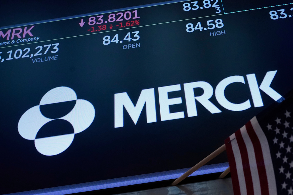FILE - The logo for Merck appears above a trading post on the floor of the New York Stock Exchange, May 1, 2025. (AP Photo/Richard Drew, File)