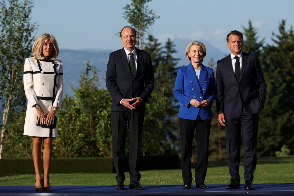 French President Emmanuel Macron, right, and his wife Brigitte Macron, left, pose with European Commission President Ursula von der Leyen and her husband Heiko von der Leyen during the G7 summit in Evian-les-Bains, France, Monday, June 15, 2026. (Isabel Infantes/Pool Photo via AP)
