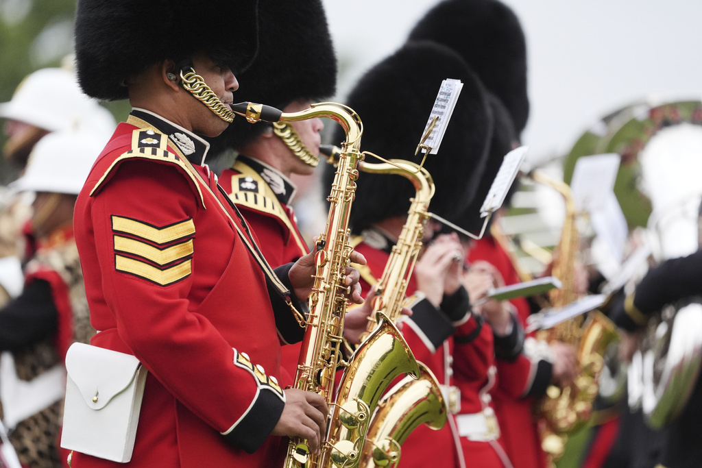 Musicians play during a Beating Retreat musical performance on the East Lawn of Windsor Castle, in Windsor, England, Wednesday, Sept. 17, 2025. (AP Photo/Evan Vucci)