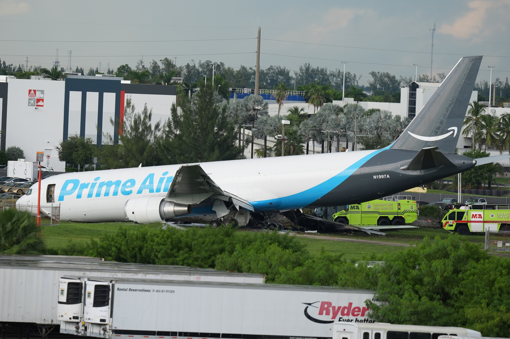 An Amazon cargo plane sits at the Miami International Airport (MIA) after it overshot the runway, Sunday, Sept. 6, 2026. (AP Photo/Lynne Sladky)
