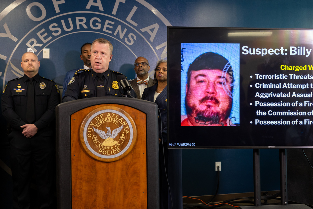 Atlanta Police Chief Darin Schierbaum speaks during a press conference at the Atlanta Police Department headquarters in Atlanta on Monday, October 20, 2025, regarding a Cartersville man, Billy Cagle, who threatened to "shoot up" the airport. (Arvin Temkar/Atlanta Journal-Constitution via AP)