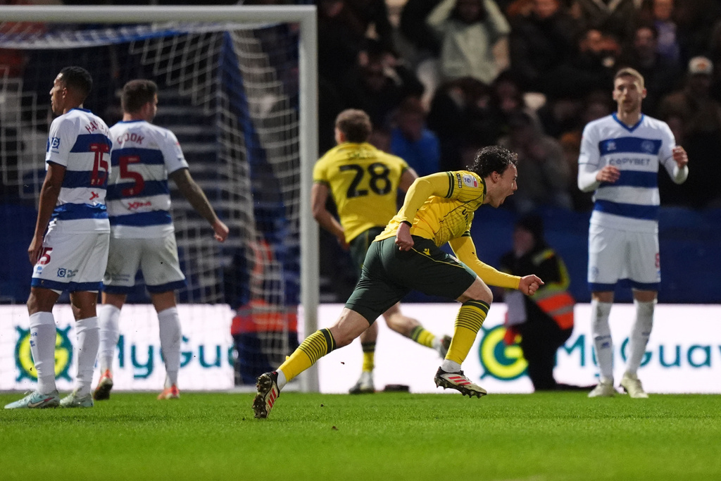 Wrexham's Ollie Rathbone, 2nd right, celebrates scoring their side's third goal of the game during the Sky Bet Championship soccer match between Queens Park Rangers and Wrexham in London, Saturday Jan. 24, 2026. (Ben Whitley/PA via AP)