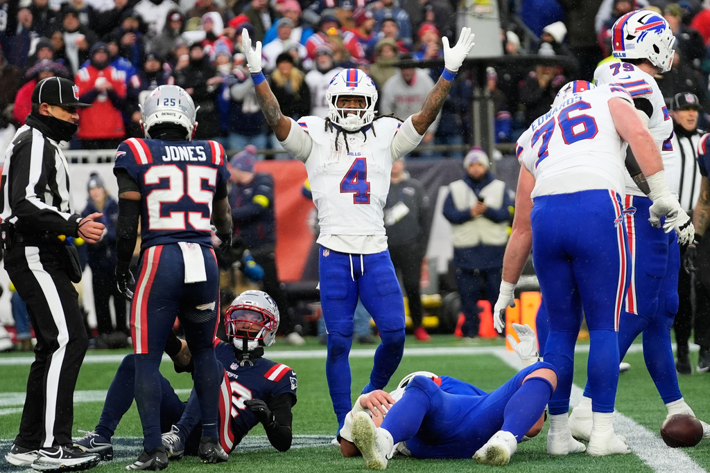 Buffalo Bills running back James Cook III (4) celebrates after scoring against the New England Patriots during the second half of an NFL football game in Foxborough, Mass., Sunday, Dec. 14, 2025. (AP Photo/Robert F. Bukaty)