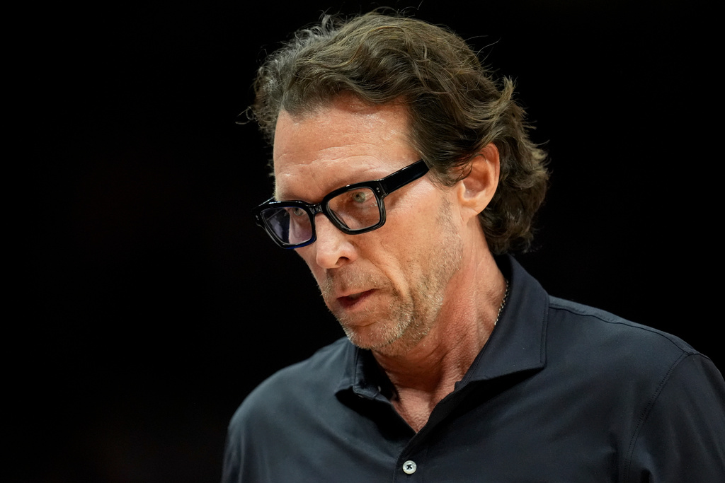 Atlanta Hawks head coach Quin Snyder walks the line during the first half of an NBA basketball game against the Boston Celtics, Saturday, Jan. 17, 2026, in Atlanta. (AP Photo/Mike Stewart)