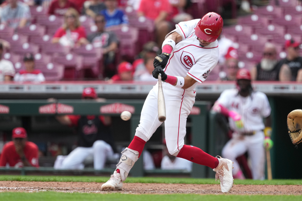 Cincinnati Reds' Edwin Arroyo hits a one-run single during the fourth inning in the first baseball game of a doubleheader against the Cleveland Guardians, Tuesday, July 28, 2026, in Cincinnati. (AP Photo/Kareem Elgazzar)