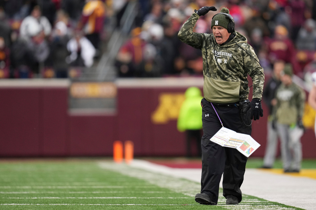 FILE - Northwestern head coach Pat Fitzgerald reacts after a pass interference penalty on Northwestern defensive back Devin Turner (23) during the first half of an NCAA college football game against Minnesota, Nov. 12, 2022, in Minneapolis. (AP Photo/Abbie Parr, File)