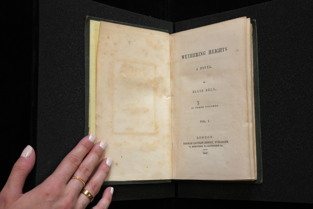 A first edition of Emily Bronte's Wuthering Heights, is on display for sale at Christie's auction house, with copies estimated at 400,000–600,000 GBP (540,000–810,000 USD) in London, Monday, June 15, 2026. (AP Photo/Kin Cheung)