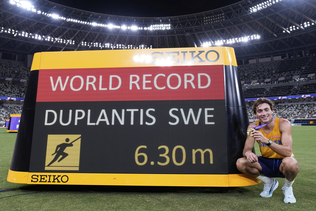 Sweden's Armand Duplantis poses after setting a new men's pole vault world record of 6.30 meters, at the World Athletics Championships in Tokyo, Monday, Sept. 15, 2025. (AP Photo/Matthias Schrader)