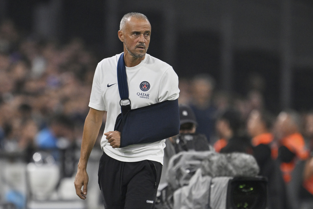 PSG's head coach Luis Enrique follows the game during the French League One soccer match between Marseille and Paris Saint-Germain at Orange Velodrome in Marseille, France, Monday, Sept. 22, 2025. (AP Photo/Philippe Magoni)