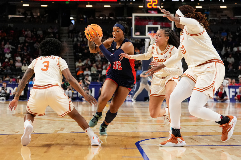 Mississippi forward Cotie McMahon drives to the basket past Texas during the first half of an NCAA college basketball game in the semifinals of the Southeastern Conference tournament, Saturday, March 7, 2026, in Greenville, S.C. (AP Photo/Chris Carlson)