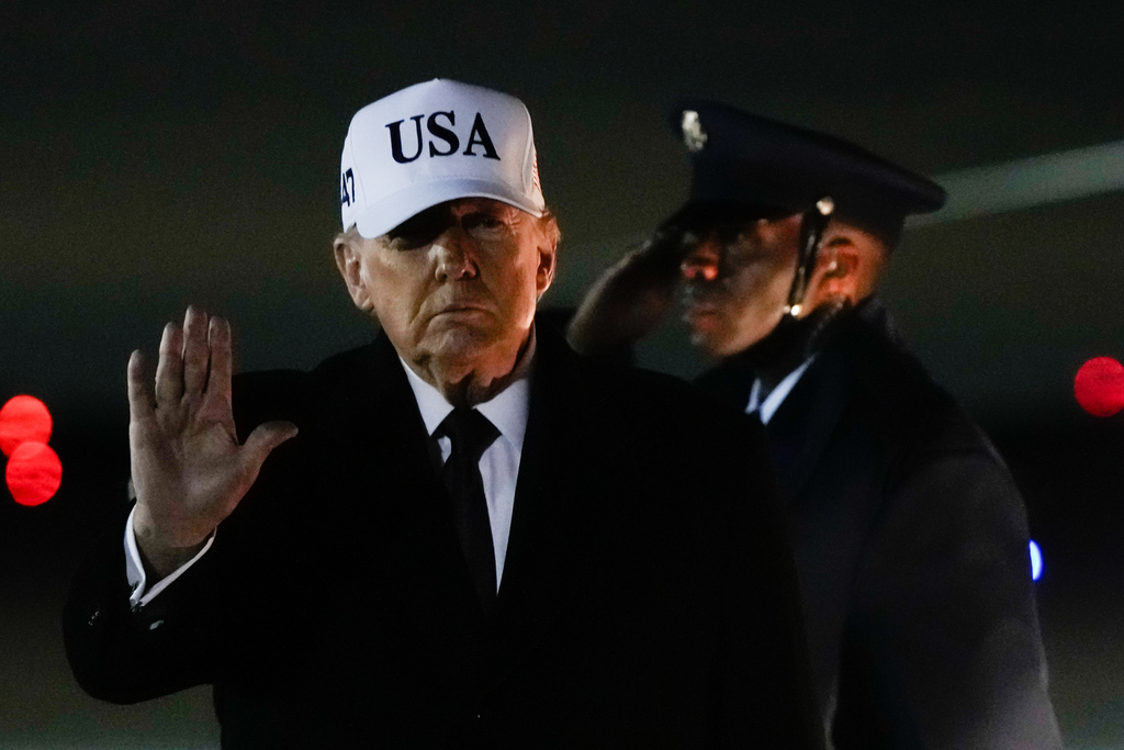 FILE - President Donald Trump waves after arriving on Air Force One from Florida, Jan. 11, 2026, at Joint Base Andrews, Md. (AP Photo/Julia Demaree Nikhinson, File)