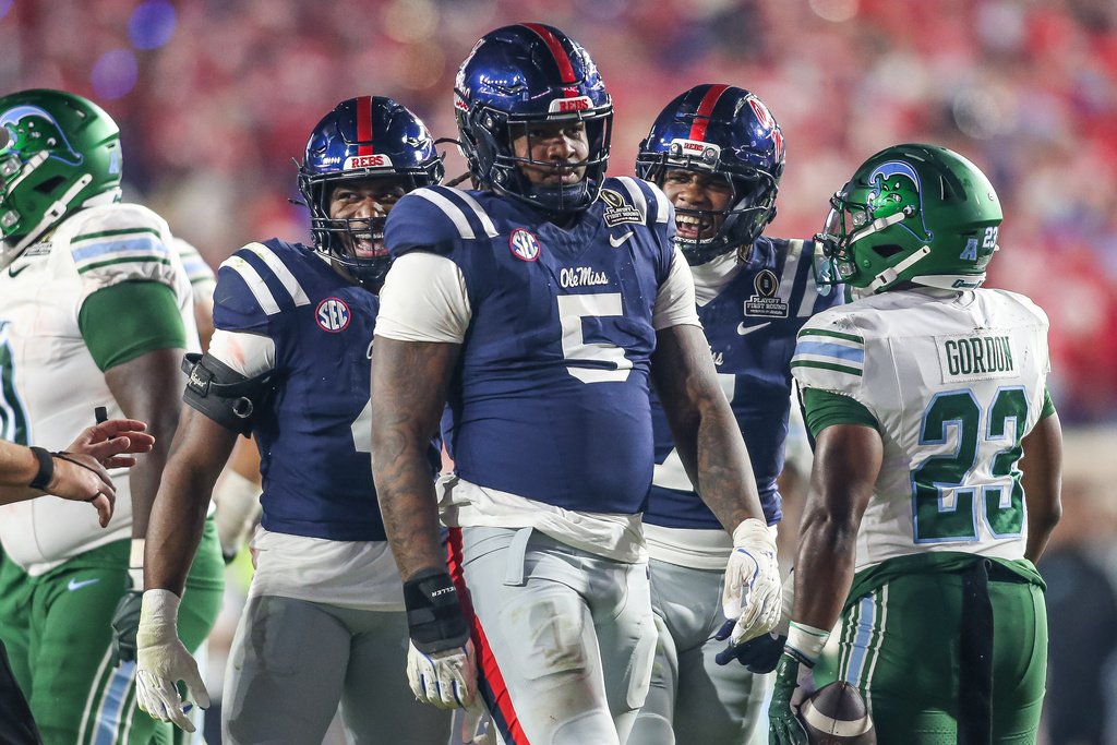 Mississippi defensive end Kam Franklin (5) reacts to a tackle against Tulane first round of an NCAA the College Football Playoff, Saturday, Dec. 20, 2025, in Oxford, Miss. (AP Photo/James Pugh)