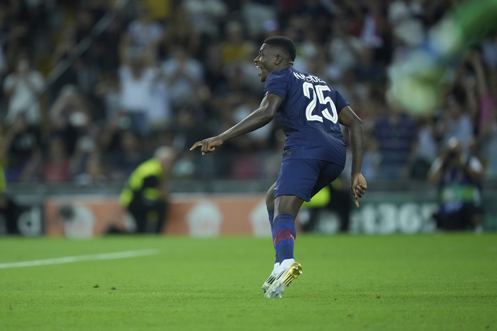 PSG's Nuno Mendes reacts during the penalty shootout the UEFA Super Cup soccer match between Paris Saint-Germain and Tottenham Hotspur in Udine, Italy, Wednesday, Aug. 13, 2025. (AP Photo/Darko Bandic)