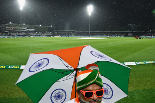 Indian fans wait as rain delays play during the T20 cricket international between India and Australia in Canberra, Australia, Wednesday, Oct. 29, 2025. (Lukas Coch/AAPImage via AP) Indian fans wait as rain delays play during the T20 cricket international between India and Australia in Canberra, Australia, Wednesday, Oct. 29, 2025. (Lukas Coch/AAPImage via AP)