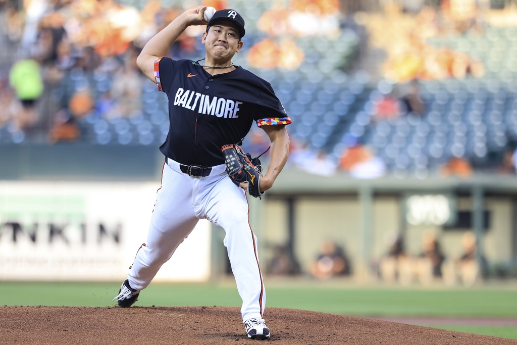 Baltimore Orioles starting pitcher Tomoyuki Sugano throws during the first inning of a baseball game against the Athletics, Friday, Aug. 8, 2025, in Baltimore. (AP Photo/Alyssa Howell)