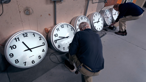 FILE - Clockmakers Rich Finn, left, and Tom Erb adjust the time zone controllers on a series of clocks that'll be installed at Paine Field in Everett, Wash., at the Electric Time Company, Wednesday, Oct. 30, 2024, in Medfield, Mass. (AP Photo/Charles Krupa, File) FILE - Clockmakers Rich Finn, left, and Tom Erb adjust the time zone controllers on a series of clocks that'll be installed at Paine Field in Everett, Wash., at the Electric Time Company, Wednesday, Oct. 30, 2024, in Medfield, Mass. (AP Photo/Charles Krupa, File)