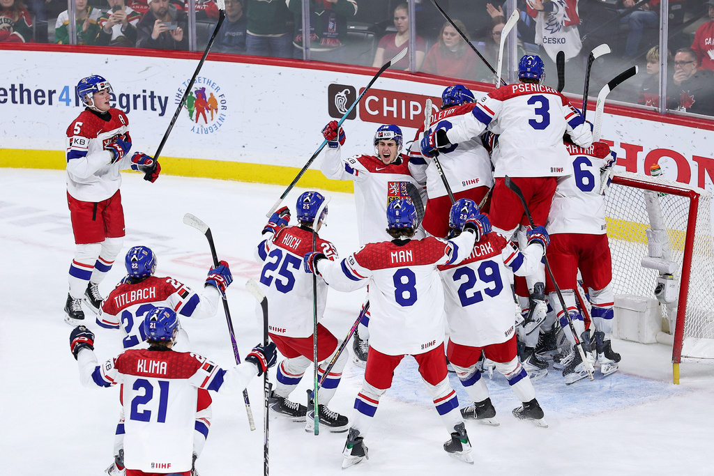 Czechia players celebrate their teams win during the third period of an IIHF World Junior Hockey Championship semifinals game against Canada, Sunday, Jan. 4, 2026, in St. Paul, Minn. (AP Photo/Matt Krohn)