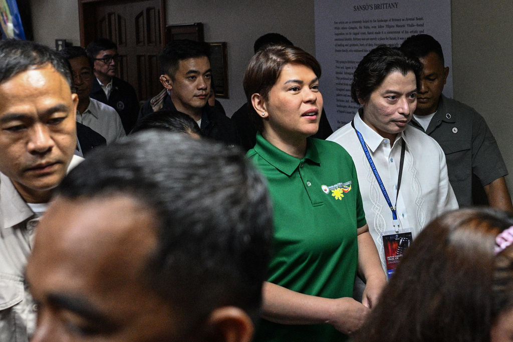 Philippine Vice President Sara Duterte, center, arrives before the start of the impeachment trial at the Senate of the Philippines in Pasay, Philippines Tuesday, July 7, 2026. (Noel Celis/Pool Photo via AP)