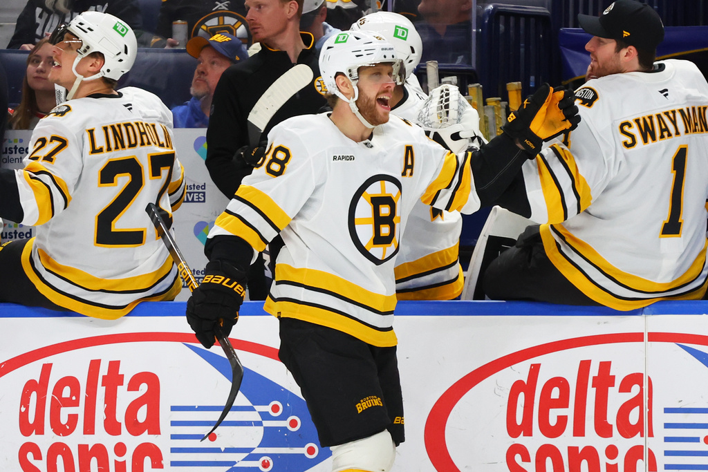 Boston Bruins right wing David Pastrnak (88) celebrates his goal during the first period of an NHL hockey game against the Buffalo Sabres Wednesday, March 25, 2026, in Buffalo, N.Y. (AP Photo/Jeffrey T. Barnes)