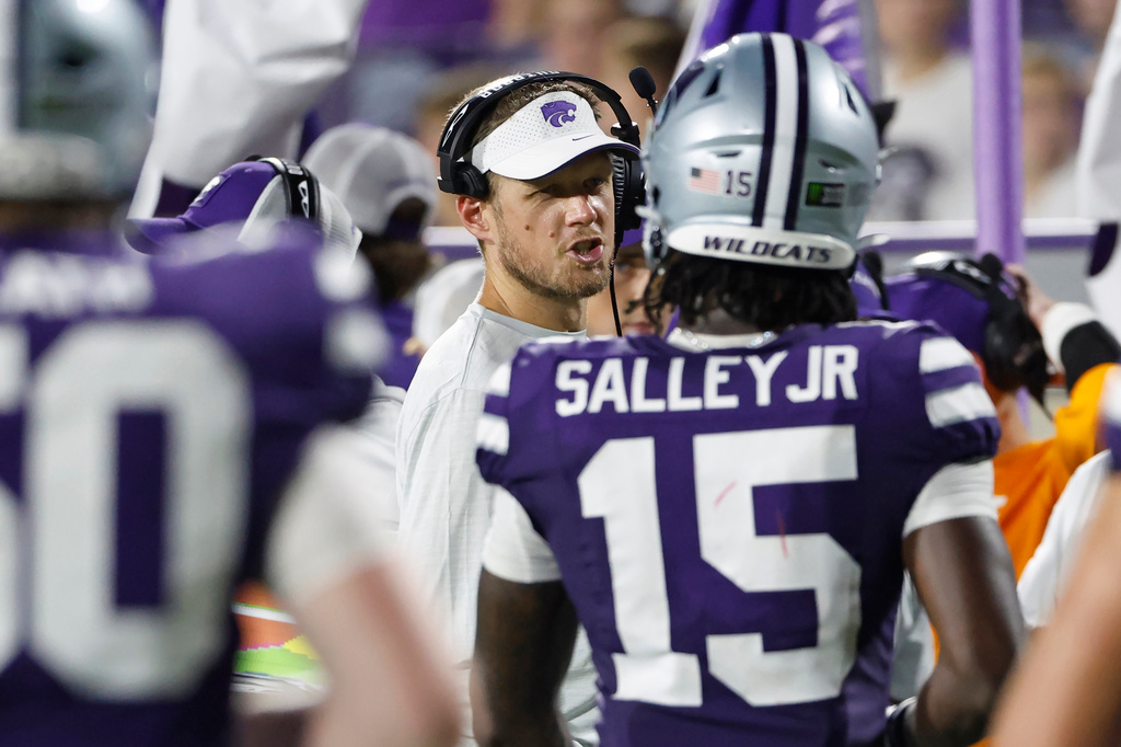 Kansas State head coach Collin Klein, center, talks to his players during the second half of an NCAA college football game against Nicholls in Manhattan, Kan., Saturday, Sept. 5, 2026. (AP Photo/Colin E. Braley)