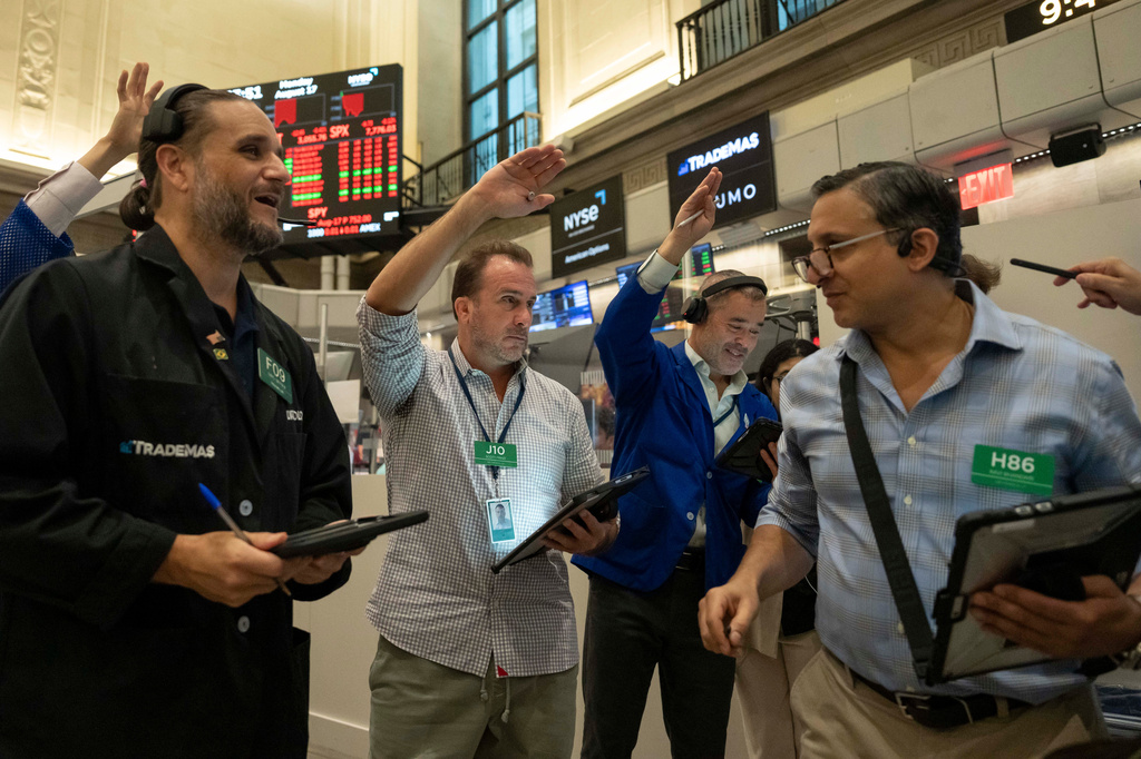 Options traders Chris Dattolo, Scott Frinzi, Justin Kanda, and Ravi Bhandari, left to right, work on the floor of the New York Stock Exchange, Monday, Aug. 17, 2026, in New York. (AP Photo/Yuki Iwamura)