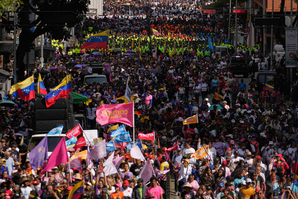 Government supporters gather for a women's march to demand the return of Venezuelan President Nicolas Maduro in Caracas, Venezuela, Tuesday, Jan. 6, 2026, three days after U.S. forces captured him and his wife. (AP Photo/Matias Delacroix)
