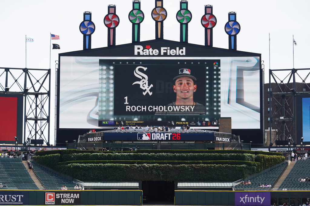 UCLA shortstop Roch Cholowsky goes No. 1 overall to the Chicago White Sox during the 2026 MLB Draft shown on the scoreboard before a baseball game between the Chicago White Sox and the Athletics Saturday, July 11, 2026, in Chicago. (AP Photo/David Banks)