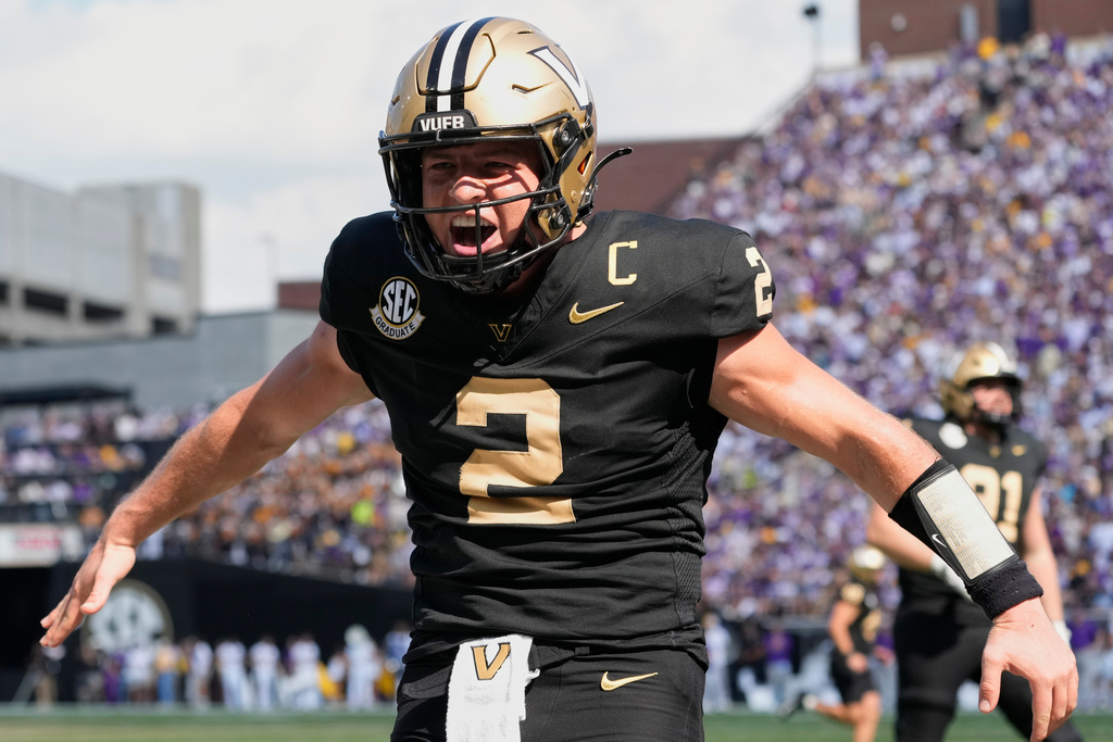 FILE - Vanderbilt quarterback Diego Pavia (2) celebrates a touchdown during the second half of an NCAA college football game against LSU, Saturday, Oct. 18, 2025, in Nashville, Tenn. (AP Photo/George Walker IV, File)