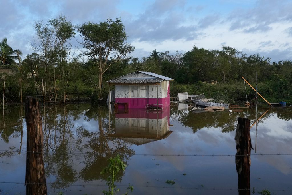 A house is flooded after Hurricane Melissa passed through Santa Cruz, Jamaica, Wednesday, Oct. 29, 2025. (AP Photo/Matias Delacroix),