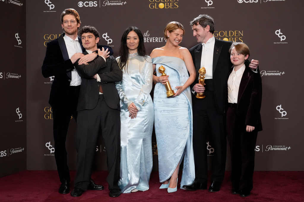 Joe Alwyn, from left, Noah Jupe, Chloe Zhao, Jessie Buckley, Paul Mescal, and Jacobi Jupe pose in the press room with the award for best motion picture - drama for "Hamnet" during the 83rd Golden Globes on Sunday, Jan. 11, 2026, at the Beverly Hilton in Beverly Hills, Calif. (AP Photo/Chris Pizzello)