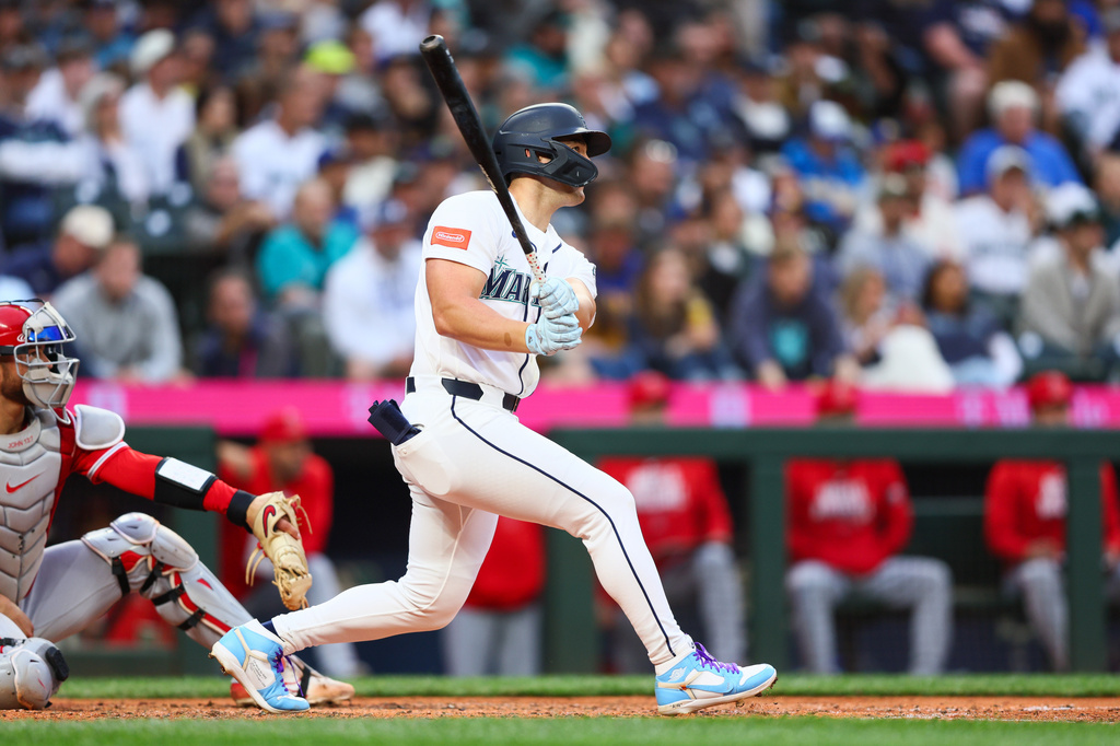 Seattle Mariners' Dominic Canzone hits a home run in the sixth inning of a baseball game against the Los Angeles Angels, Monday, June 29, 2026, in Seattle. (AP Photo/Kevin Ng)