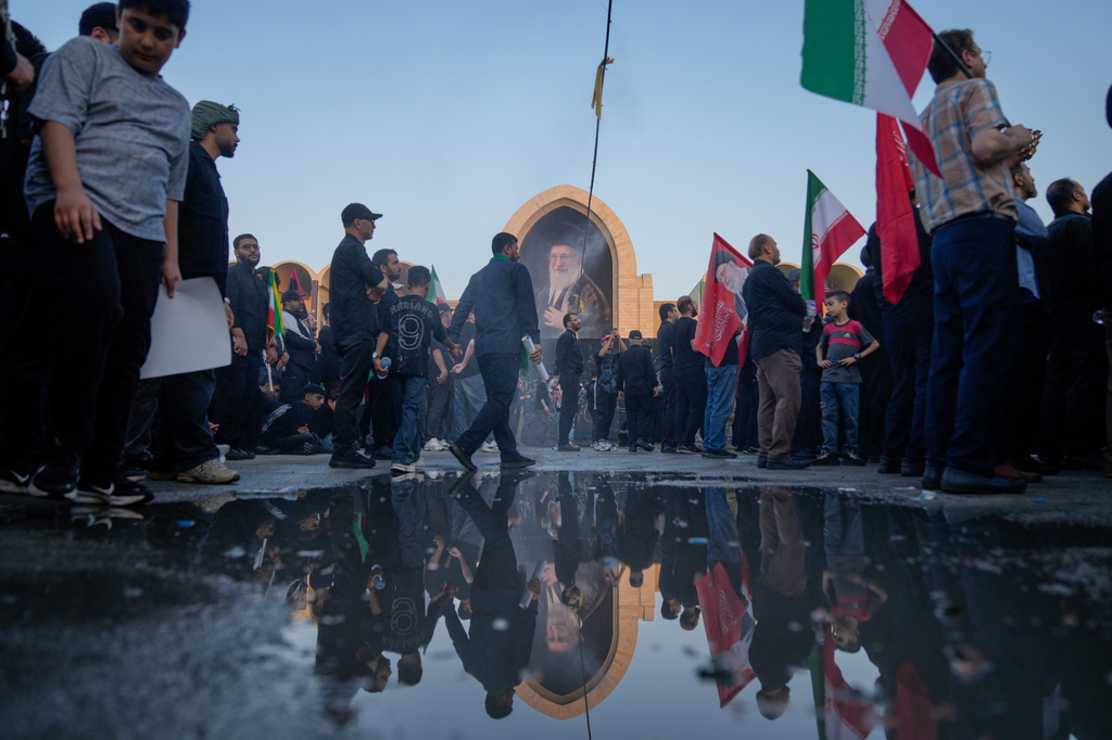 Mourners walk through the grounds of the Imam Khomeini Mosalla Grand Mosque during the funeral ceremonies for slain Iranian Supreme Leader Ayatollah Ali Khamenei and members of his family in Tehran, Iran, Saturday, July 4, 2026. (AP Photo/Altaf Qadri)