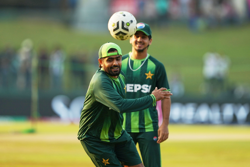 Pakistan's Babar Azam, left, warms up before the start of the T20 World Cup cricket match between Pakistan and Sri Lanka in Pallekele, Sri Lanka, Saturday, Feb. 28, 2026. (AP Photo/Eranga Jayawardena)