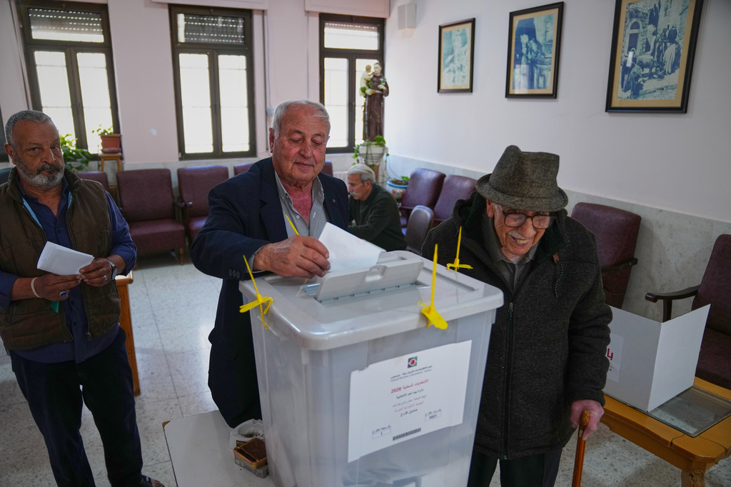Palestinian Christians cast their votes in local elections at a polling station in Bethlehem, West Bank, Saturday, April 25, 2026. (AP Photo/Mahmoud Illean)