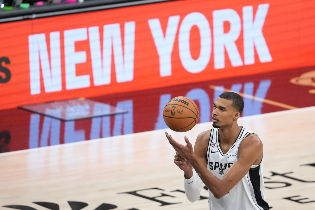 San Antonio Spurs forward Victor Wembanyama shoots a free throw during the first half of Game 2 of the NBA Finals basketball series against the New York Knicks, Friday, June 5, 2026, in San Antonio. (AP Photo/Eric Gay)