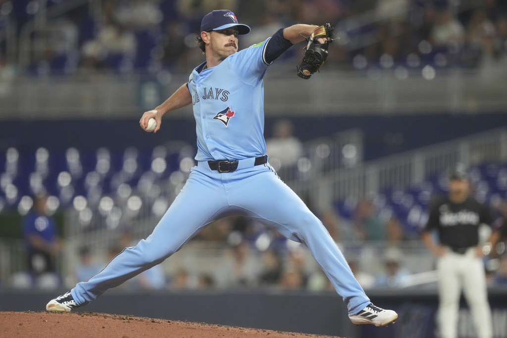 Toronto Blue Jays starting pitcher Shane Bieber aims a pitch during the first inning of a baseball game against the Miami Marlins, Friday, Aug. 22, 2025, in Miami. (AP Photo/Marta Lavandier)