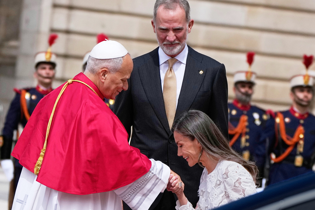Pope Leo XIV is welcomed by Spain's King Felipe VI and Queen Letizia, as he arrives at the Royal Palace in Madrid, Saturday, June 6, 2026, on the first day of his seven-day apostolic journey to mainland Spain and the Canary Islands. (AP Photo/Alessandra Tarantino)