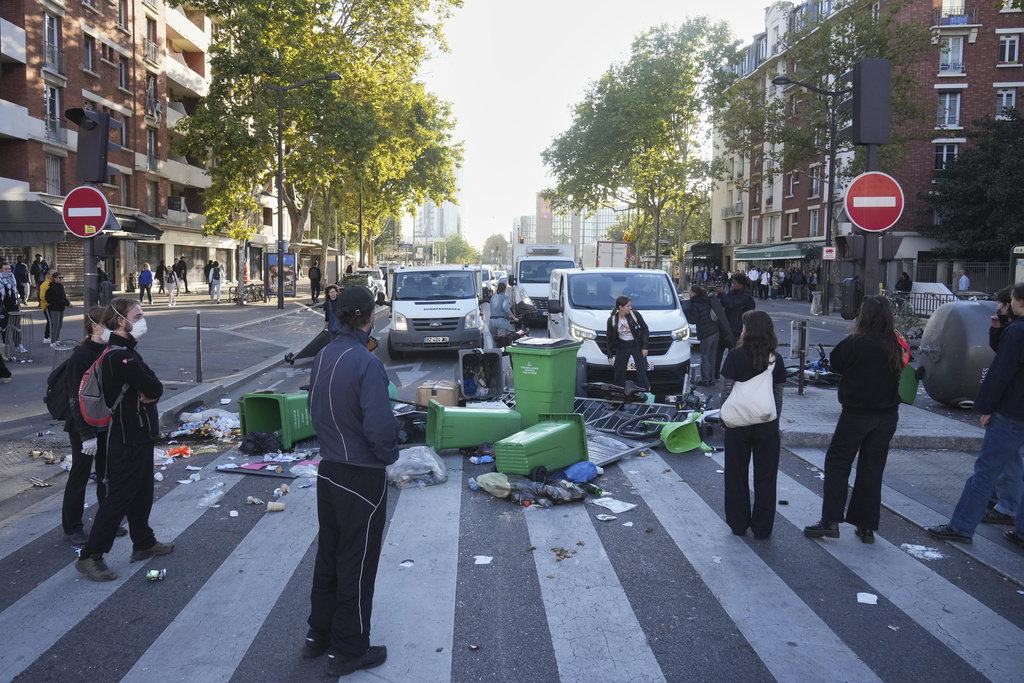 Protesters block a street during the "Bloquons Tout" (Block Everything) protest movement in Paris, Wednesday, Sept. 10, 2025. (AP Photo/Thibault Camus)