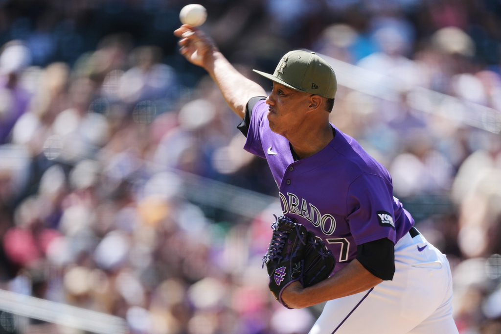 Colorado Rockies relief pitcher Juan Mejia works against the Arizona Diamondbacks in the seventh inning of a baseball game Saturday, May 16, 2026, in Denver. (AP Photo/David Zalubowski)