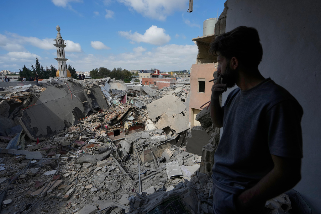 A man looks at a destroyed building that was hit in an Israeli airstrike in Burj al-Shemali village near the southern port city of Tyre, Lebanon, Tuesday, May 26, 2026. (AP Photo/Mohammed Zaatari)