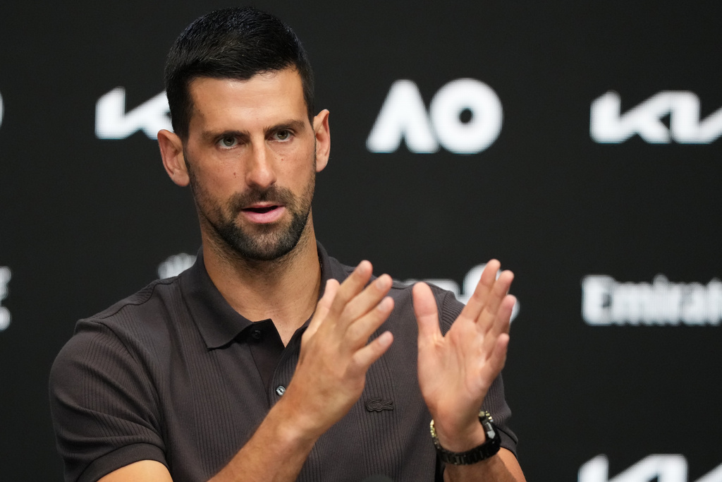 Novak Djokovic of Serbia gestures during a press conference ahead of the Australian Open tennis championship in Melbourne, Australia, Saturday, Jan. 17, 2026. (AP Photo/Aaron Favila)