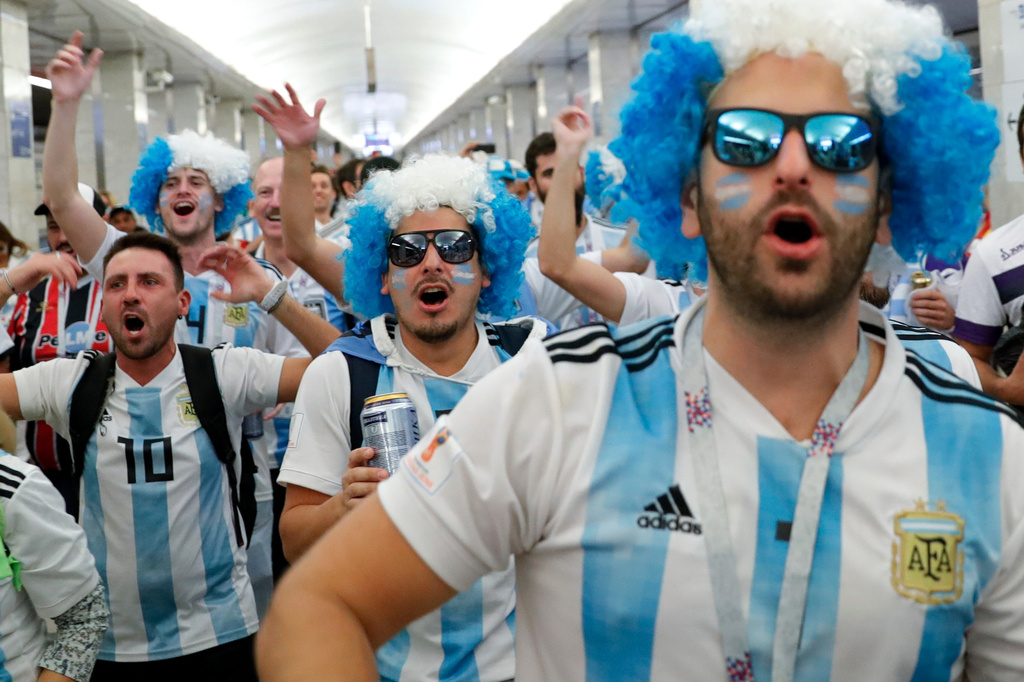 FILE - Fans of Argentina commute at the Moscow Metro on their way to the group D match between Argentina and Iceland at the 2018 soccer World Cup in the Spartak Stadium in Moscow, Russia, Saturday, June 16, 2018. (AP Photo/Ricardo Mazalan, File)
