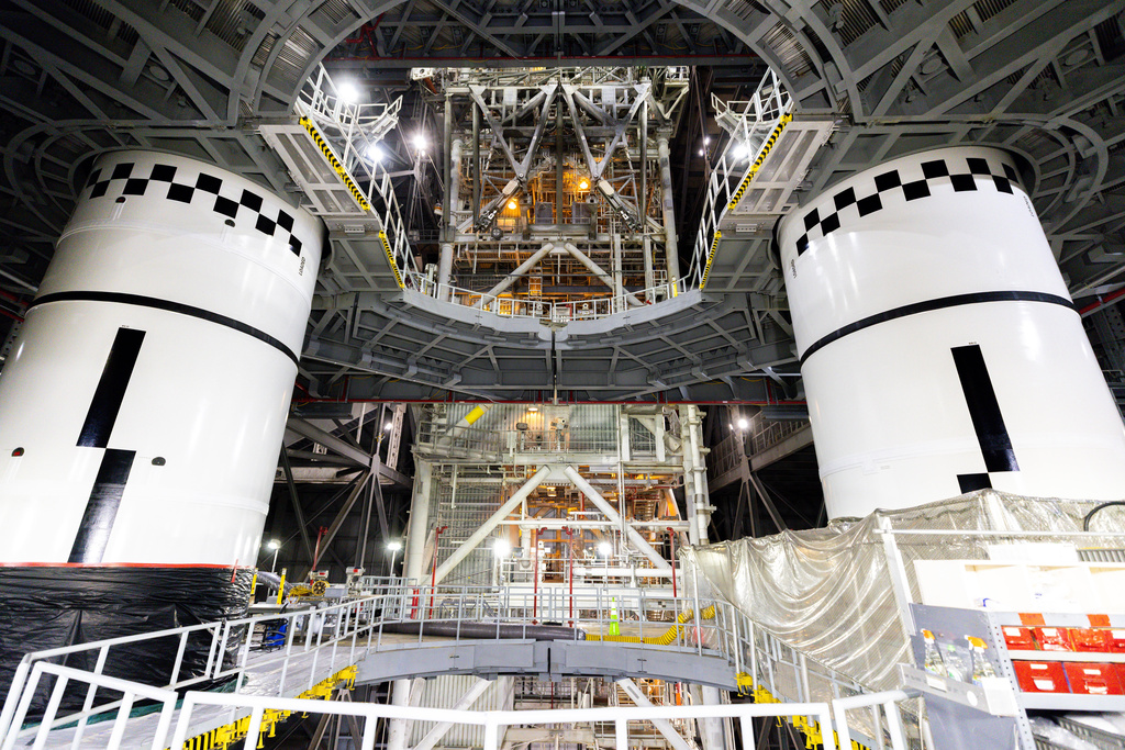In this photo provided by NASA, the final left and right forward solid rocket booster motor segments for Artemis III are integrated onto the mobile launcher for the SLS (Space Launch System) rocket on Thursday, Sept. 24, 2026 at NASA's Kennedy Space Center in Florida. (Frank Michaux/NASA via AP)